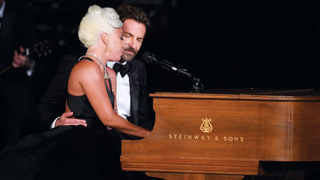 Lady Gaga performs "Shallow" on a walnut Steinway grand piano with co-star Bradley Cooper