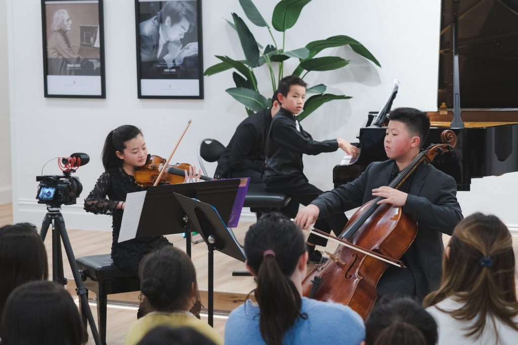 Pianist Dillon Chan, violinist Paige Wu, and cellist Gabriel Tian Liu performing Mendelssohn Piano Trio No. 1 in D minor.