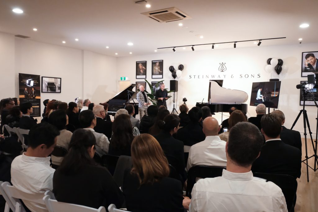CEO Mark O'Connor introducing the Steinway SPIRIO piano to the audience 