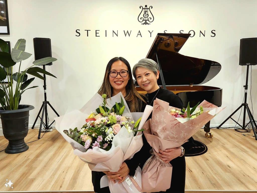 Sale Manager June O'Connor with piano teacher Patricia Lau. 