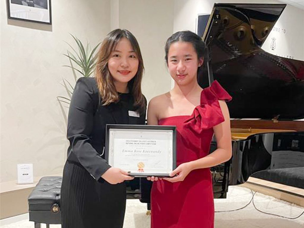 Assistant Manager Lisha Feng with pianist Emma Rose Koeswandy.