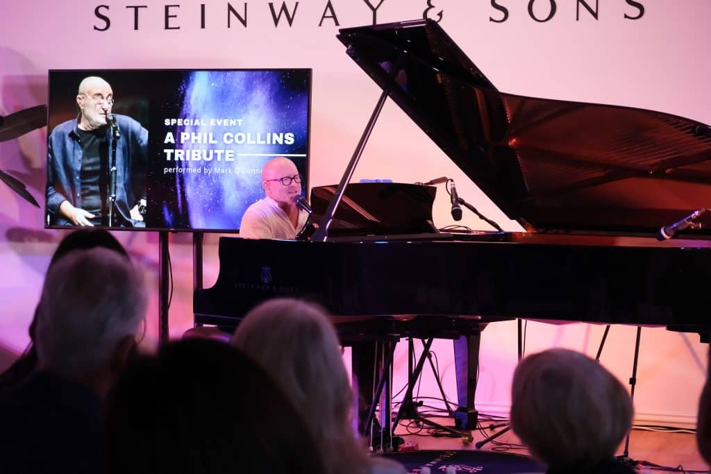 Phil Collins Tribute Event at Steinway Gallery Melbourne. CEO Mark O'Conner is performing on the Steinway & Sons piano.