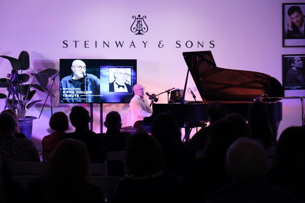 Phil Collins Tribute Event at Steinway Gallery Melbourne. CEO Mark O'Conner is performing on the Steinway & Sons piano.